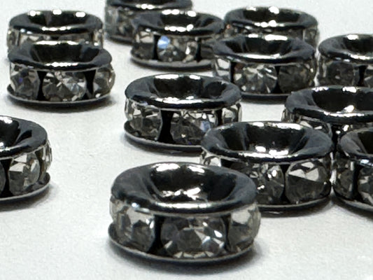 Spacers 6mm dark silver with crystal. Very sparkly.